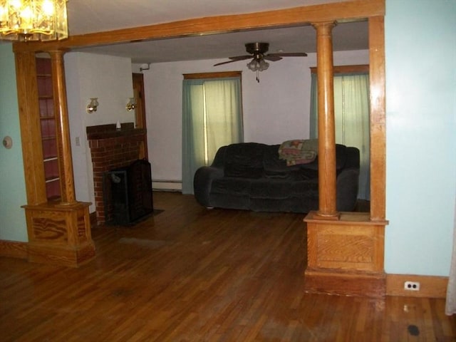 19 Chestnut, Winchendon, MA 01475 - living room featuring wood finished floors, a chandelier, ceiling fan, baseboard heating, and a fireplace