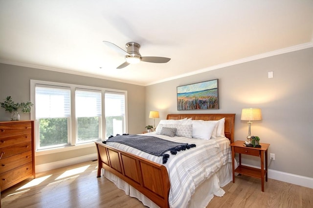 bedroom featuring light wood-type flooring, baseboards, and ornamental molding