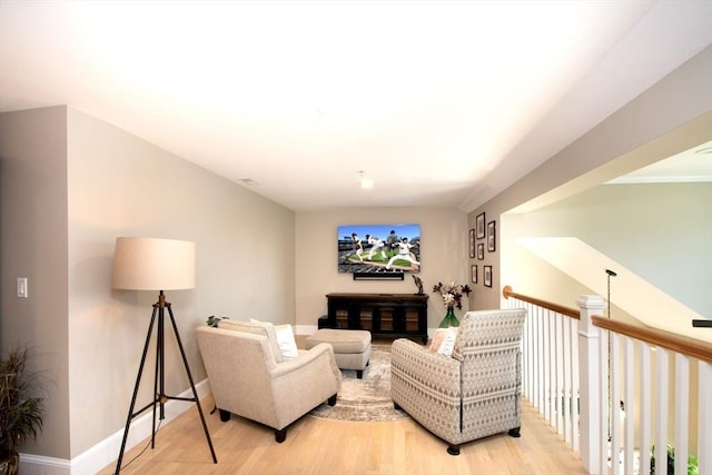 living room featuring light wood finished floors and baseboards