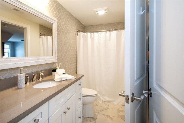 full bathroom featuring toilet, visible vents, marble finish floor, curtained shower, and vanity