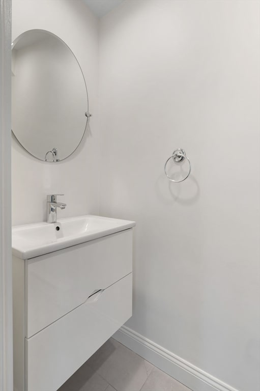 bathroom with tile patterned floors and vanity