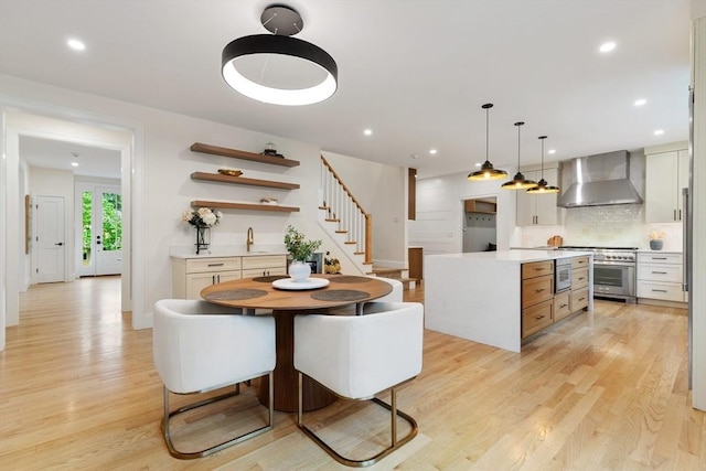 92 Cedar St, Lexington, MA 02421 - dining space with light wood-style floors, stairway, recessed lighting, and baseboards