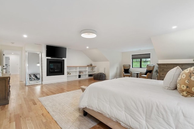 92 Cedar St, Lexington, MA 02421 - bedroom featuring a fireplace, light wood-type flooring, and recessed lighting