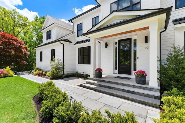 92 Cedar St, Lexington, MA 02421 - entrance to property with covered porch and a lawn