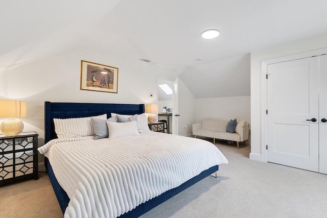 92 Cedar St, Lexington, MA 02421 - carpeted bedroom with vaulted ceiling, baseboards, and a closet