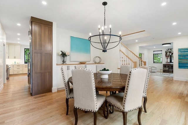 92 Cedar St, Lexington, MA 02421 - dining space featuring stairway, light wood finished floors, recessed lighting, a chandelier, and baseboards