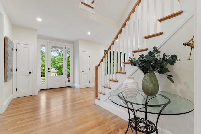 92 Cedar St, Lexington, MA 02421 - entryway with wood finished floors, stairs, recessed lighting, and baseboards