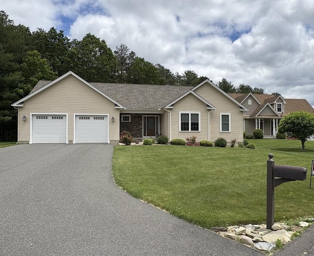 43 Caddyshack Dr, Chicopee, MA 01020 - view of front of home featuring an attached garage, driveway, and a front lawn