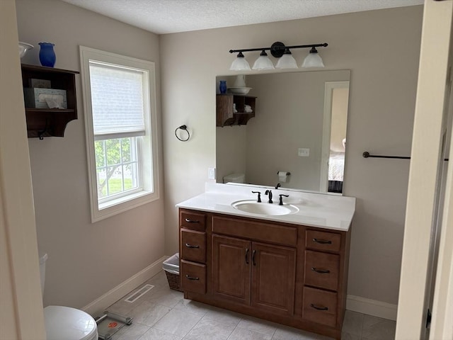 43 Caddyshack Dr, Chicopee, MA 01020 - half bathroom with vanity and tile patterned floors