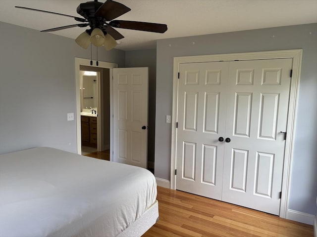 43 Caddyshack Dr, Chicopee, MA 01020 - bedroom featuring light wood-style flooring, a closet, a ceiling fan, and ensuite bathroom