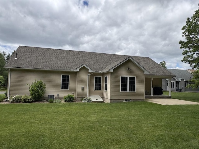43 Caddyshack Dr, Chicopee, MA 01020 - view of front of house featuring a patio, a front lawn, and roof with shingles