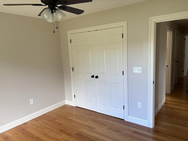 43 Caddyshack Dr, Chicopee, MA 01020 - unfurnished bedroom with wood finished floors, a closet, and ceiling fan