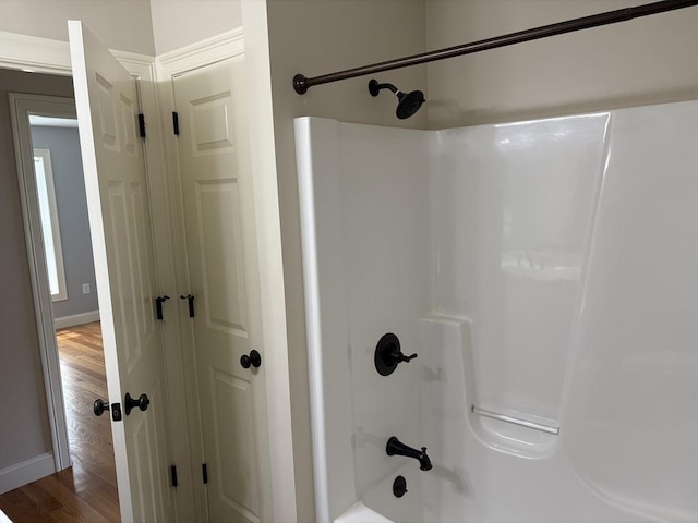 43 Caddyshack Dr, Chicopee, MA 01020 - full bathroom featuring wood finished floors and shower / bath combination