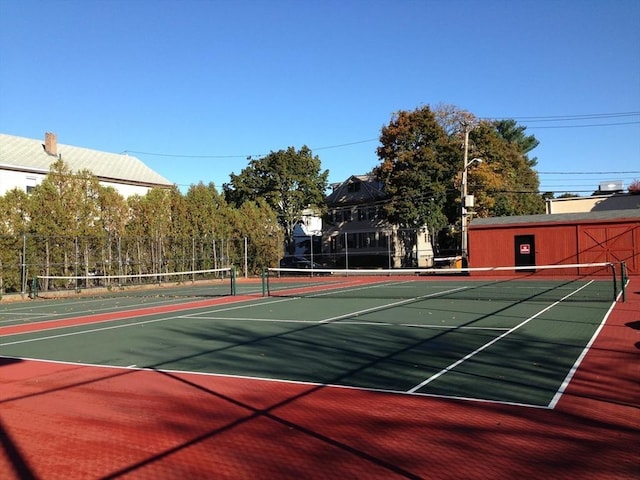 view of sport court with community basketball court and fence