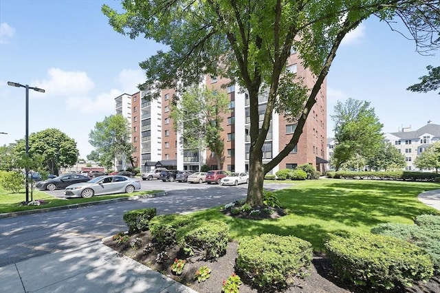 view of property featuring uncovered parking