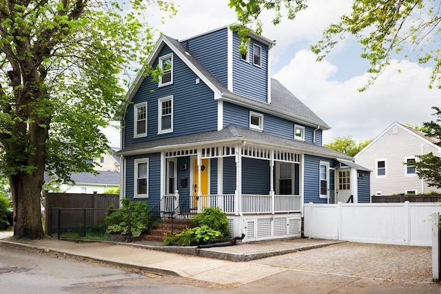 36 Warwick St, Somerville, MA 02145 - view of front facade with a porch and roof with shingles