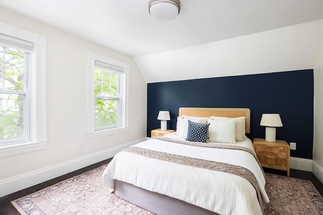 36 Warwick St, Somerville, MA 02145 - bedroom with baseboards, vaulted ceiling, and wood finished floors