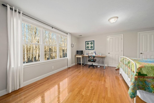 bedroom featuring wood-type flooring