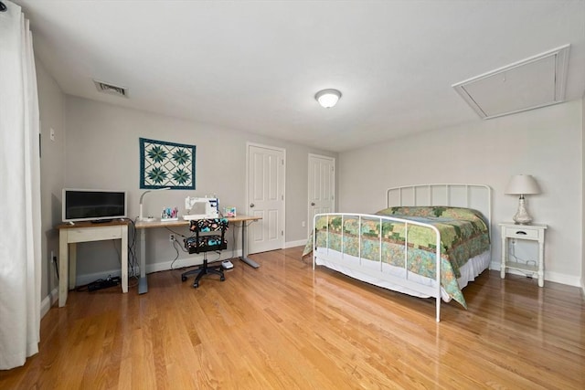 bedroom with hardwood / wood-style floors