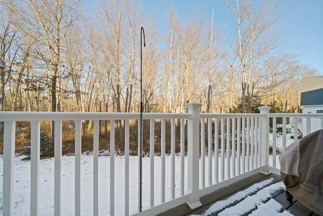 snow covered deck featuring area for grilling