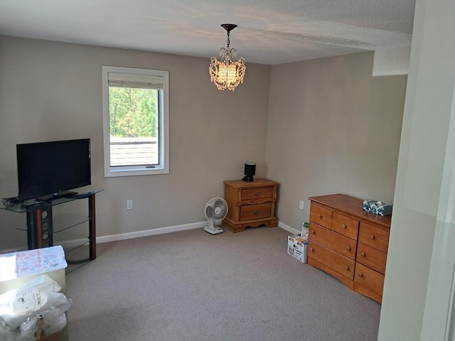 3901 Woodbridge Rd Unit 3901, Peabody, MA 01960 - living area with carpet flooring, baseboards, and a chandelier