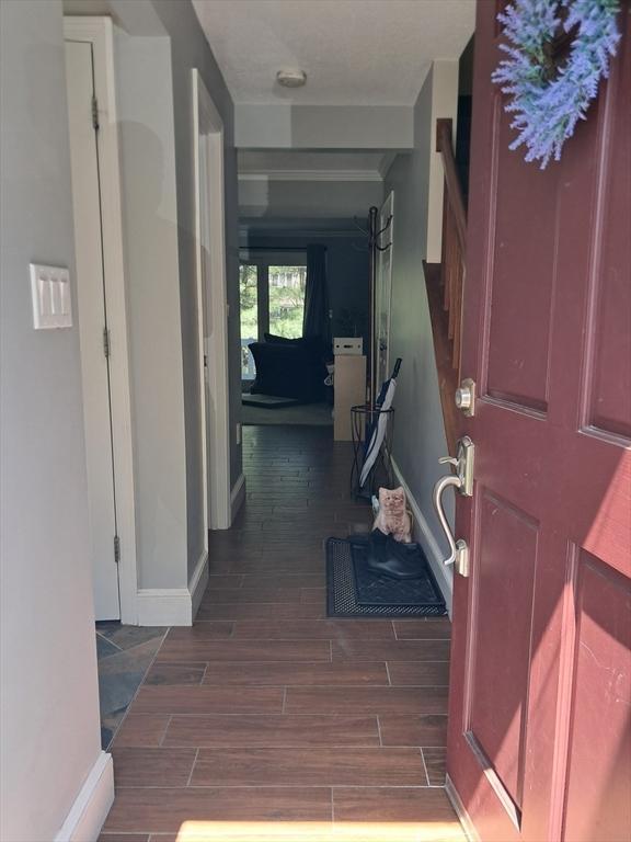3901 Woodbridge Rd Unit 3901, Peabody, MA 01960 - hallway with wood tiled floors and baseboards