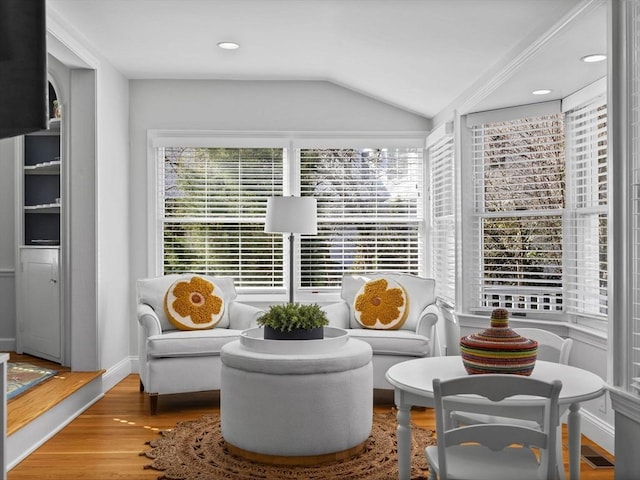 sitting room featuring wood finished floors, baseboards, vaulted ceiling, and recessed lighting
