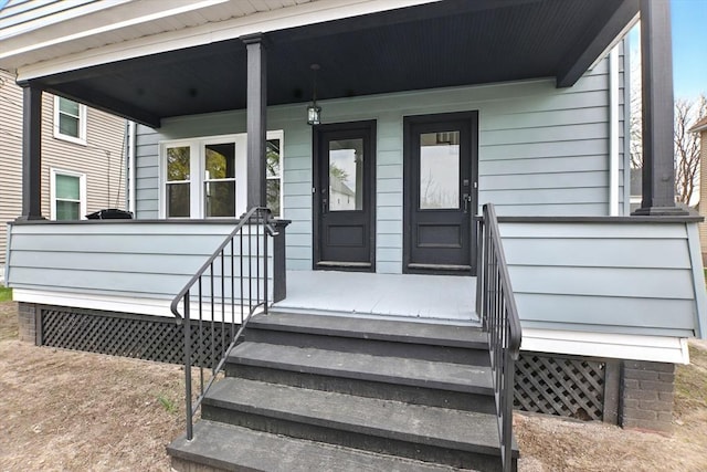 doorway to property featuring covered porch