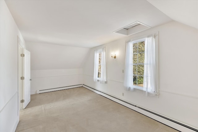 bonus room with light colored carpet, a baseboard radiator, and vaulted ceiling