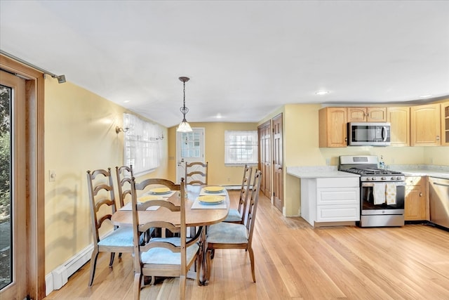 dining room featuring light hardwood / wood-style floors