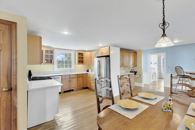 dining space featuring light hardwood / wood-style floors and sink