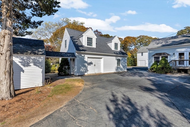 view of front of house with an outdoor structure