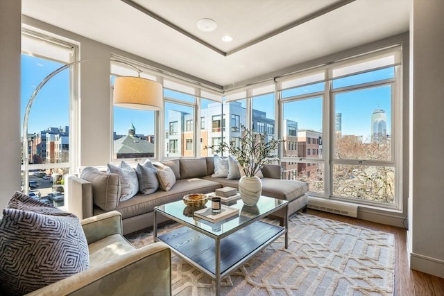 sunroom / solarium with a view of city and visible vents