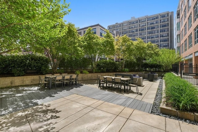 view of patio / terrace with outdoor dining area and fence