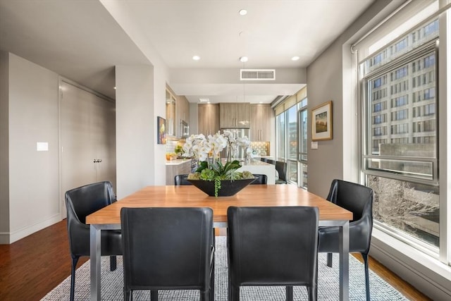 dining space with recessed lighting, dark wood-style floors, and visible vents