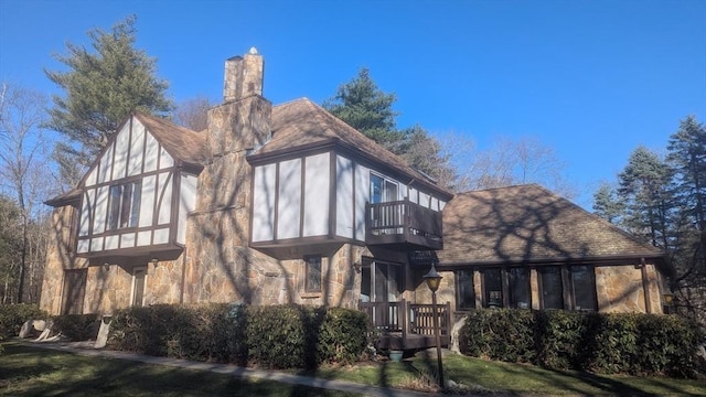 23 Carr Rd, Berlin, MA 01503 - rear view of house with a balcony, a chimney, and a yard