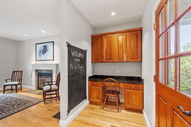 10 Londonderry Ln, Georgetown, MA 01833 - office area with built in study area, light wood-style floors, recessed lighting, and a glass covered fireplace