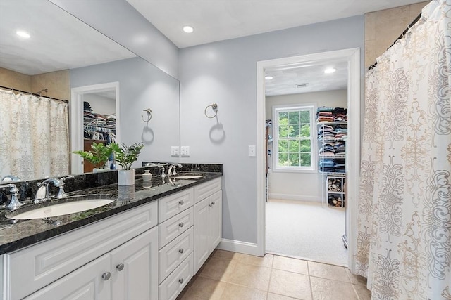 10 Londonderry Ln, Georgetown, MA 01833 - full bathroom featuring a walk in closet, double vanity, recessed lighting, tile patterned floors, and a shower with shower curtain