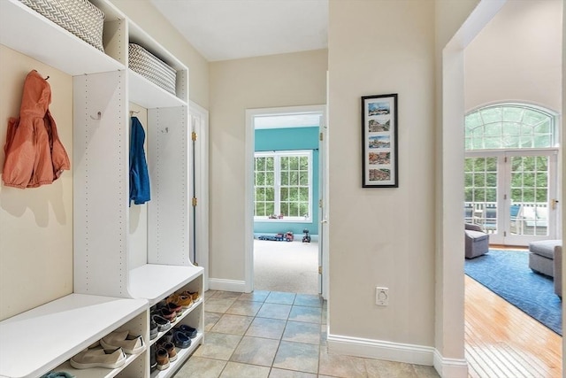 10 Londonderry Ln, Georgetown, MA 01833 - mudroom with baseboards and light tile patterned floors