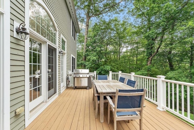 10 Londonderry Ln, Georgetown, MA 01833 - wooden terrace featuring outdoor dining space and view of scattered trees