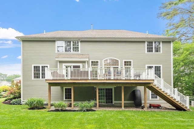 10 Londonderry Ln, Georgetown, MA 01833 - rear view of house featuring stairs, a wooden deck, and a lawn
