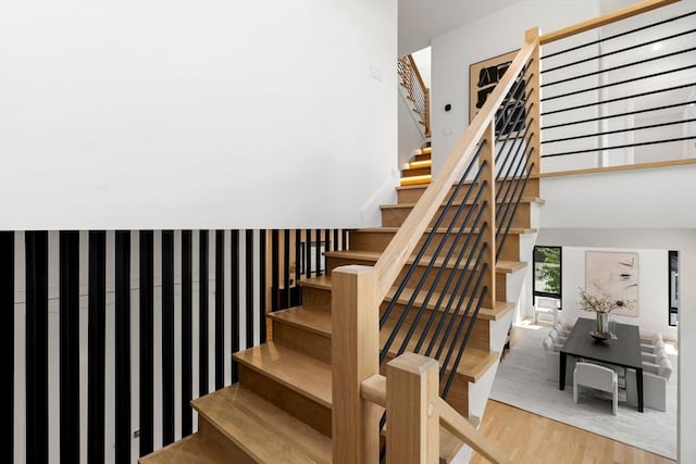 staircase with wood finished floors