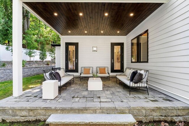 view of patio featuring an outdoor hangout area and fence