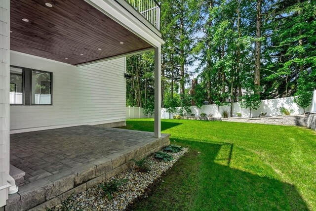 view of yard featuring a patio area and a fenced backyard