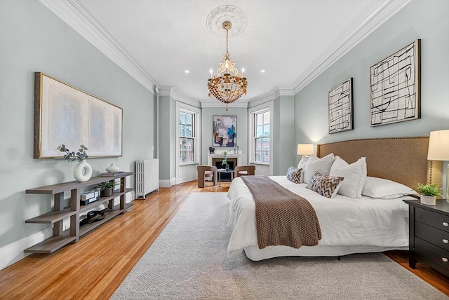 318 Commonwealth Ave Unit 3, Boston, MA 02115 - bedroom featuring radiator, wood finished floors, ornamental molding, a chandelier, and recessed lighting