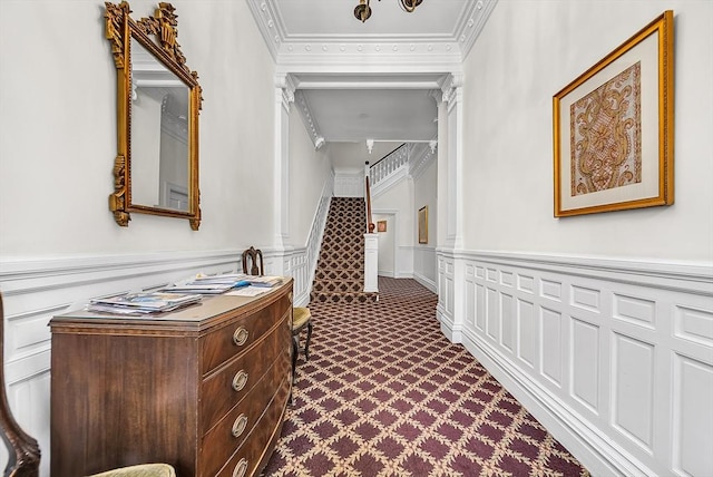 318 Commonwealth Ave Unit 3, Boston, MA 02115 - hallway featuring a decorative wall, a wainscoted wall, crown molding, and dark colored carpet