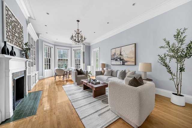 318 Commonwealth Ave Unit 3, Boston, MA 02115 - living area featuring a chandelier, ornamental molding, wood finished floors, and a high end fireplace