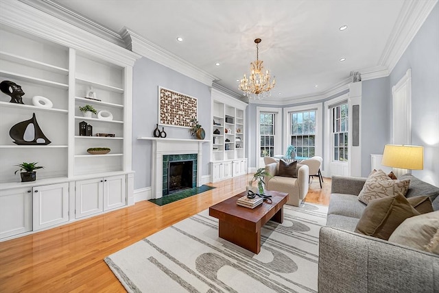 318 Commonwealth Ave Unit 3, Boston, MA 02115 - living area with light wood finished floors, crown molding, recessed lighting, a chandelier, and a premium fireplace