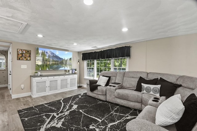 369 Vernon St, Wakefield, MA 01880 - living room with light wood finished floors, recessed lighting, and attic access