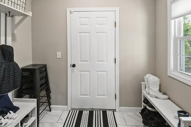 369 Vernon St, Wakefield, MA 01880 - mudroom with light marble finish flooring and baseboards